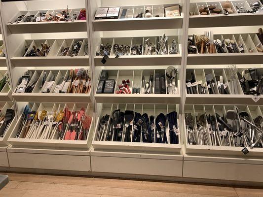 A wonderful wall of kitchen utensils and cutlery.