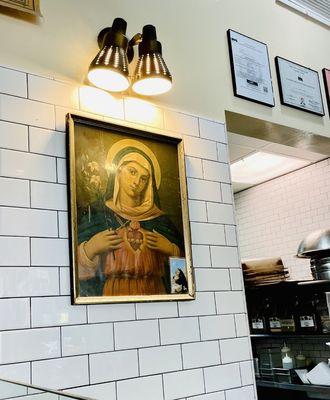 Mother Mary watches over the food prep here, which exceeds the Health & Human Services Agency standards. : )