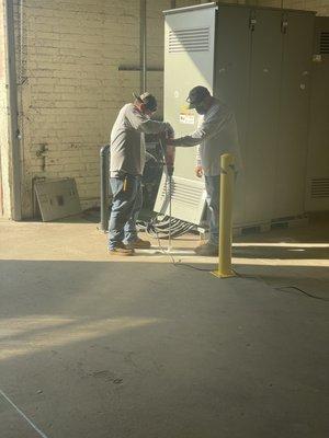 Adrain and Juan working on Final terminations for a new Transfer Switch. City of LA COVID PROJECT.