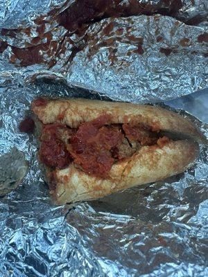 Half of the meatball sandwich.