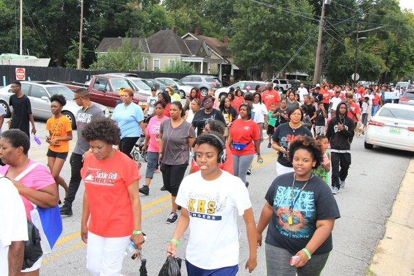 Supporters walking for their warrior.