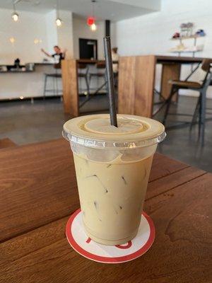 Iced vanilla latte with oat milk