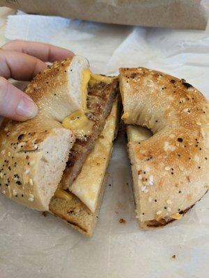 Everything bagel with sausage egg and cheese (top side)