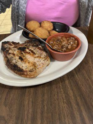 Pork chop, fried squash, meaty beans