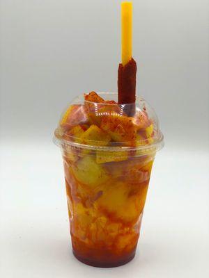 50/50 - Mango and Pineapple chunks with Mango and Pineapple Sorbet. Topped with Nectar Juice, Chamoy, Hot Sauce, Lime, and Tajin