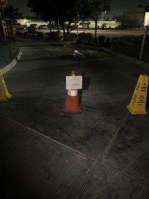 Paper signs written in sharpie saying close during store hours