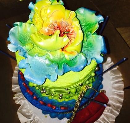 Small Dominican cake with vibrant color. Gentleman that helped me with my order did a great job bringing my vision into reality!