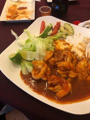 Camarones a la diabla~ Sooo delicious!! Shrimp cooked in homemade red spicy sauce. Comes with rice & salad