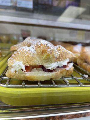 Fresh strawberries with cream cheese on croissant