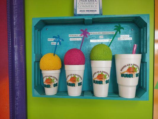 Different size and yes you do get a palm tree with each shave ice!