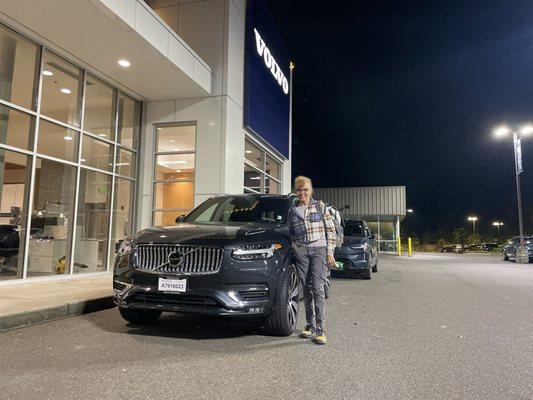 Happy customer with her purchase from Maher At Volvo cars Tacoma