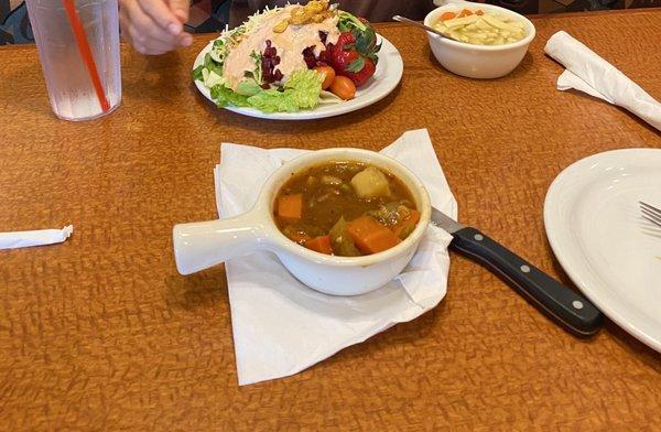 Salad bar salad and a bowl of beef stew from salad bar