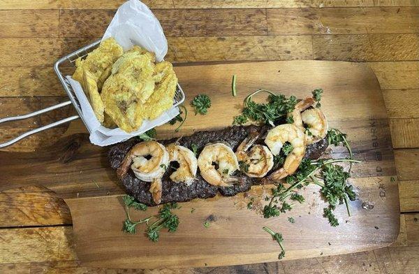 Grilled churrasco and shrimp w/ a side of fried plaintains (tostones).