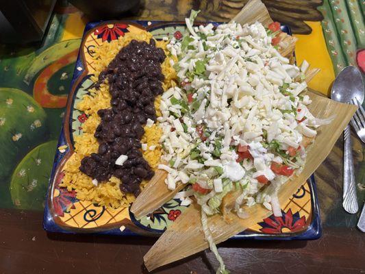 The massive three-tamale plate with beans and rice.