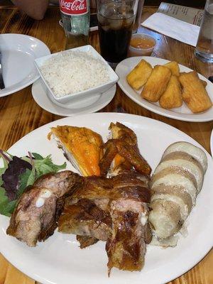 Combo 1/4 chicken, 1/4 pork ribs, white rice and baked potatoes as the sides. Yucca fried apart.