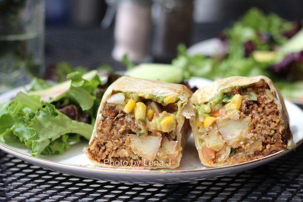 Vegan Burrito ($14) - potatoes, chorizo Brinery tempeh, avocado, salsa verde, pico de gallo, red pepper cashew sauce. Served w salad.