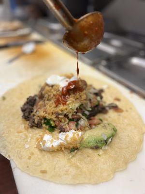 LENGUA BURRITO WITH RED SAUCE IN THE MAKE