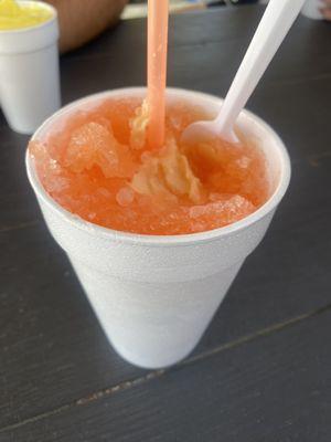 Peach snowcone with peach homemade ice cream in the middle! So good!