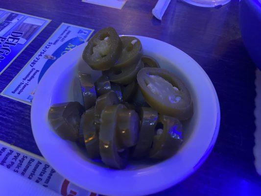 Nachos come with a hefty helping of pickled jalapeños.