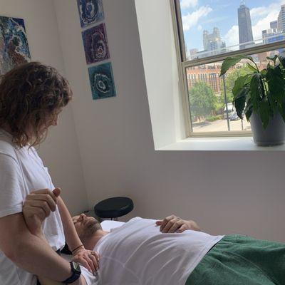 Caitlin treating a shoulder in one of our private treatment rooms with a view!