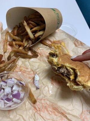 Single burger with cheese and the random onions on the side