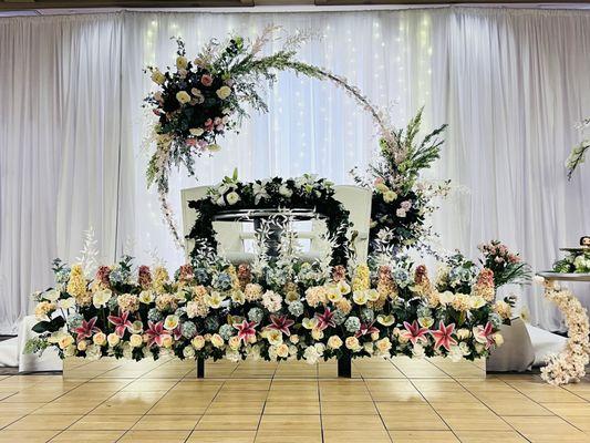 Staging decoration design; flowers, carpet, furniture, drapes, lights, backdrop. 
We can do custom designs for you!