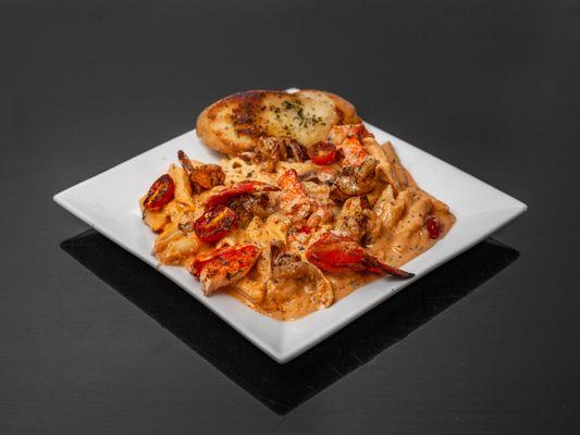 Pleasantly spicy, creamy pink sauce, sauteed shrimp, poached lobster green onions, and herb-toasted crostini