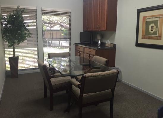 Our conference room with a view of the peaceful walking path located behind our building.