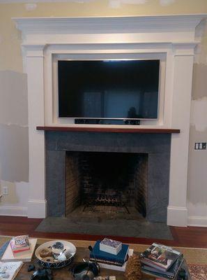 Home fireplace with TV built in by homeowner Chris Lenda. Reprepared and painted in a Waterborne by John G.