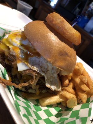 The GRONK burger  yum piled with pulled pork onion rings & a fried egg!