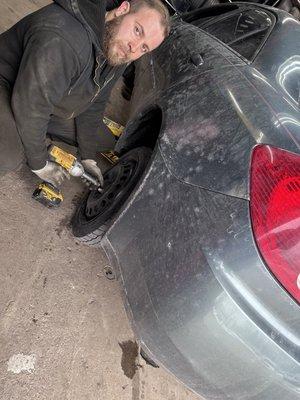 Joe swapping a donut to an actual tire