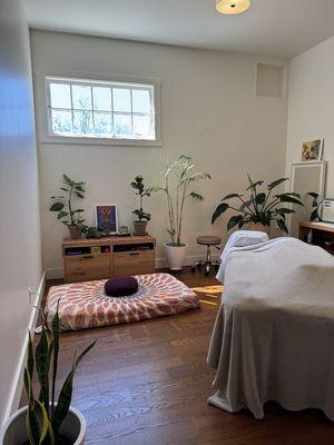 Side lying set up for prenatal massage. Meditation space.