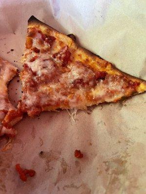 This is their "pizza". It's actually just a piece of pre-made pita flatbread with some tomato sauce and cheese. Avoid this monstrosity!