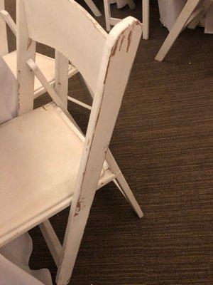 On many of the chairs, the paint was scraped off in several places.