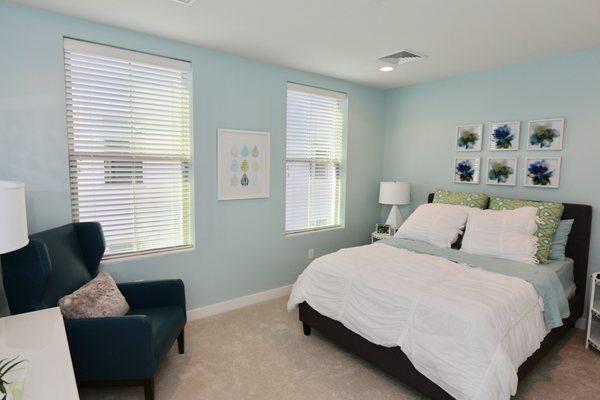 Guest room windows covered with Hunter Douglas Parkland Wood blinds.