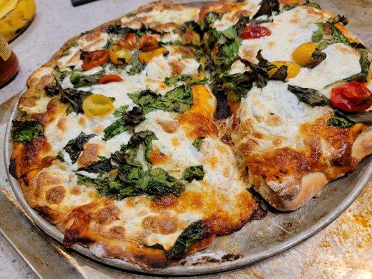 Homemade dough I made with thick&thin crust pizza with basil, spinach and fresh mozzarella from HEB ingredients .Want some?