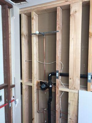 Hot / cold waters, drain and vent pipes and condensation drain lines installed for basement rec room 30 of 57