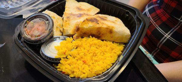 Quesadilla with chicken; yellow rice side.