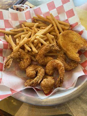 Fried shrimp with a side of seasoned fries