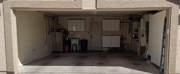 GARAGE BEFORE.. Rueben removed cabinets and wall, a/c unit, moved attic access, repaired drywall and painted.  Outstanding job!  5 STARS!