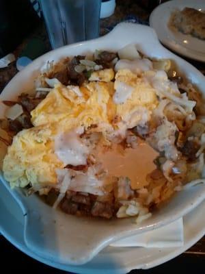 Country skillet- hashbrowns, sausage, peppers and onions, eggs and sausage gravy.