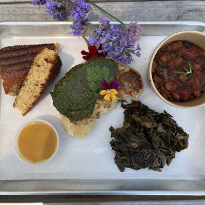 Cauliflower Steak Plate, Topped with Raisin Pesto and served with choice of two sides and cornbread