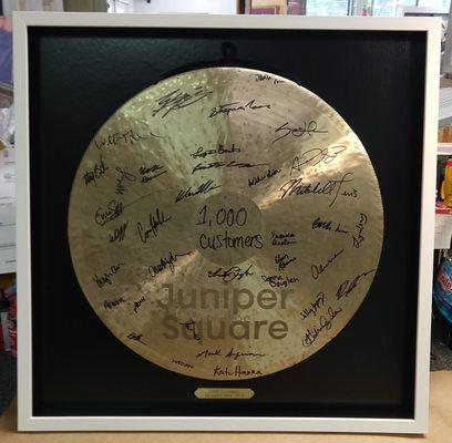 This is a signed gong signifying a goal reached by a local business