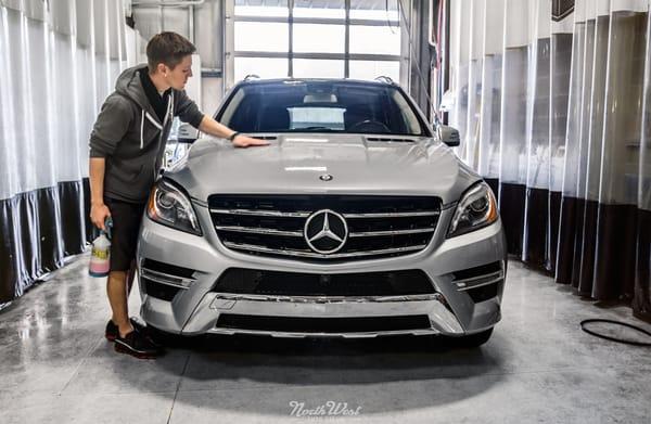 A Mercedes GL55 gets clay bar decontamination in preparation for an XPEL paint protection package.