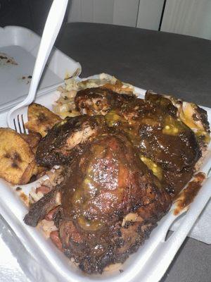 Jerk chicken combo over red beans and rice with seasoned cabbage and plantains, STACKED enough for 2nds or to share