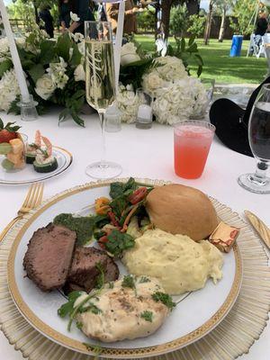 Tri tip with chimmi-churri sauce, creamy garlic chicken, roasted garlic Yukon gold mashed potatoes, and garden salad.