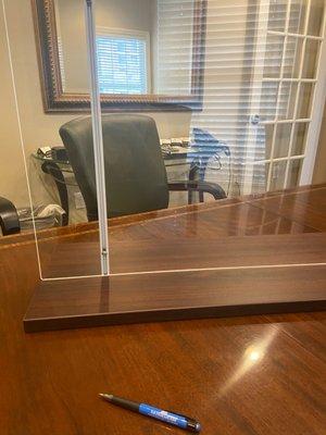 Conference table with plexiglass partition