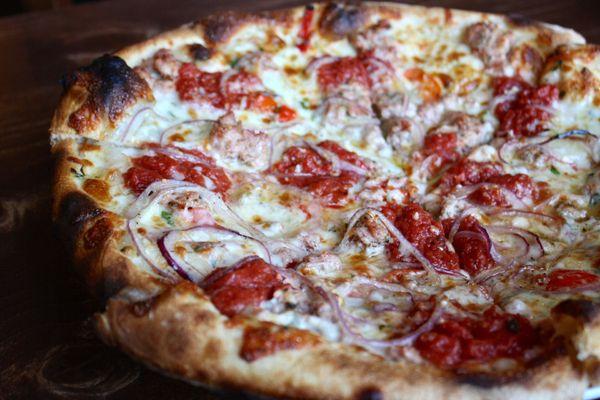 Sausage Pizza with House Made Italian Sausage, Red Onion, Sweet Peppers, Crushed Tomato, Mozzarella, Garlic Oil