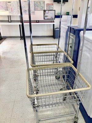 At least 3 rolling carts with hang bars.