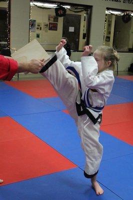 Pushing through a tough break at Ellixson's Tae Kwon Do Academy